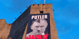 Igaunija, Narva, karš Ukrainā, plakāts, Putlers, kara noziedznieks